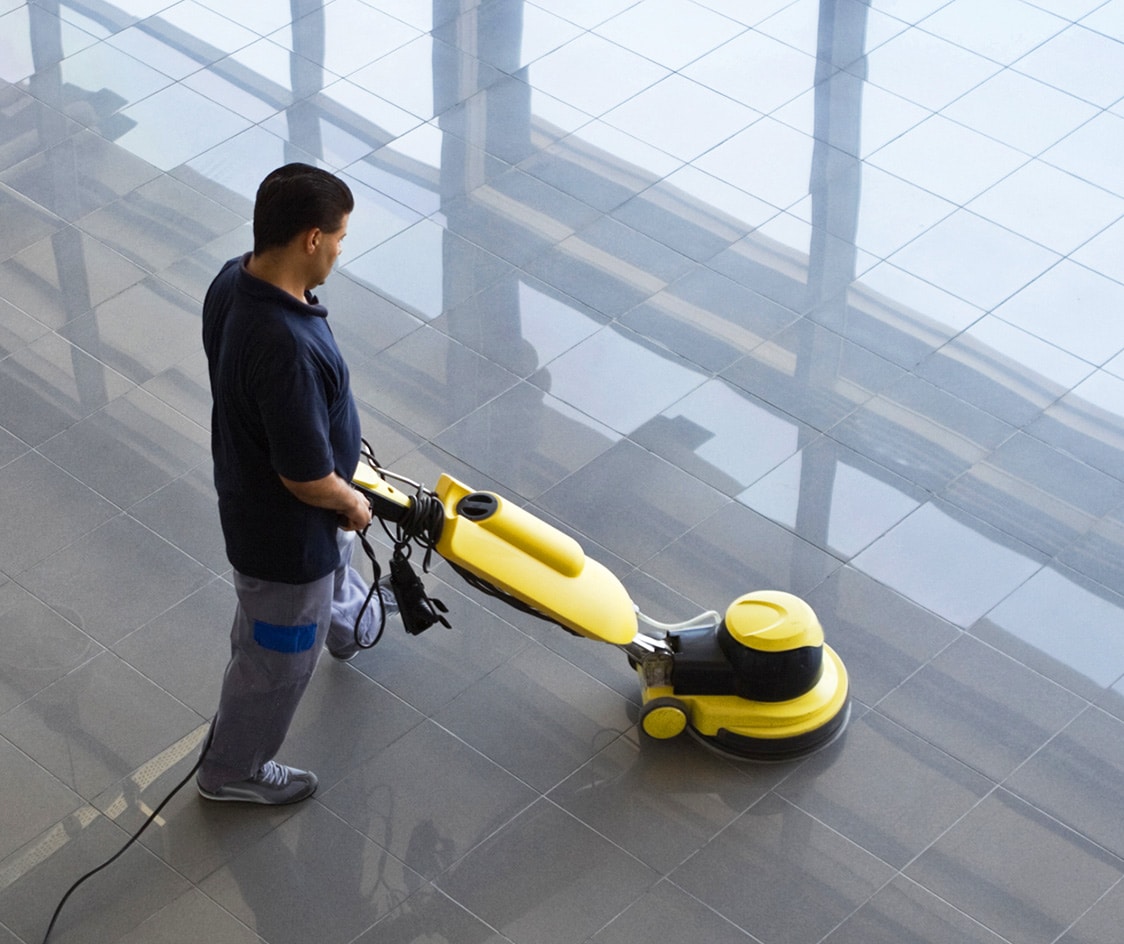 man buffing floors